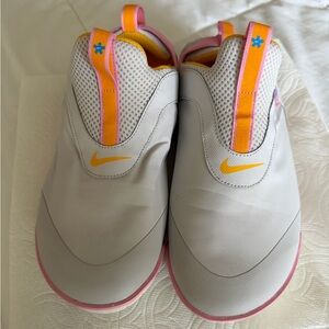 Nike White and Pink Slip-On Shoes with Yellow Swoosh